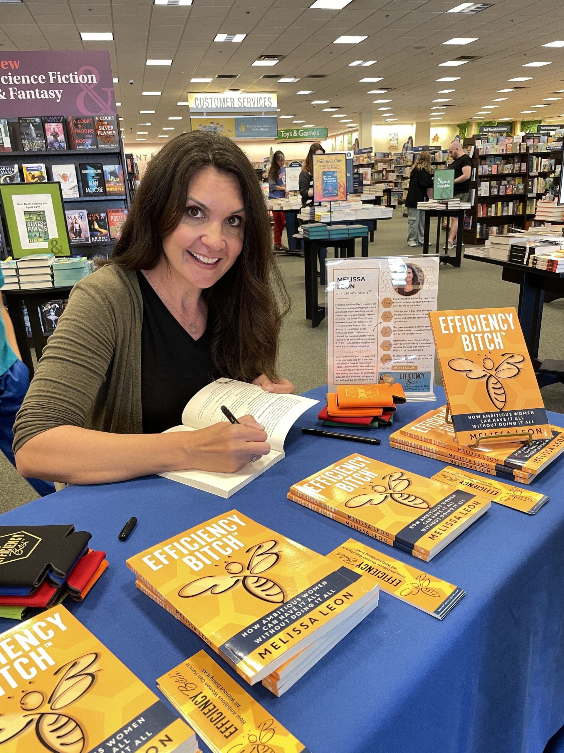 Professional author at book signing